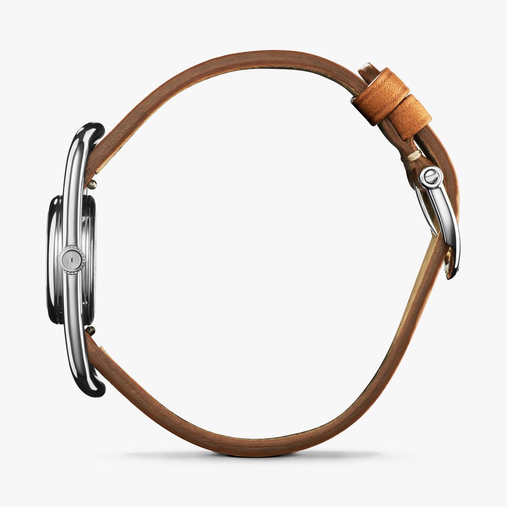 Shinola silver watch with brown leather strap, side view