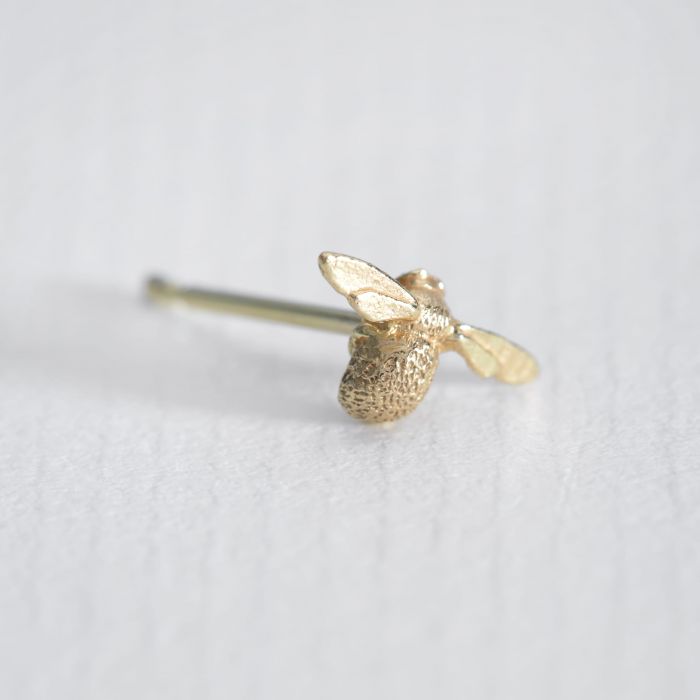 Alex Monroe gold bee stud earring, angled front view