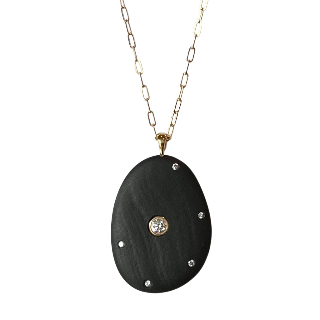 CVC Stones gold necklace with black rock and inset diamonds, front view
