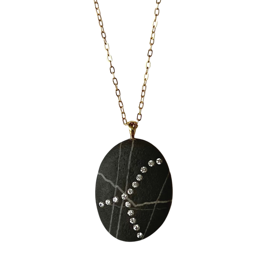 CVC Stones gold necklace with black and white striped stone and inset diamonds, front view