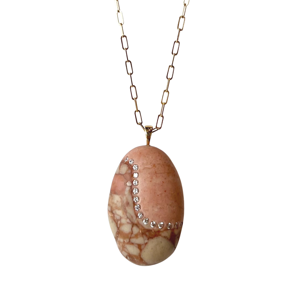 CVC Stones gold necklace with peach colored rock and inset diamonds, front view