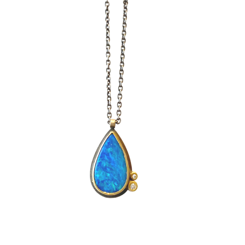 Ananda Khalsa silver necklace with blue opal, gold, and diamonds, front view