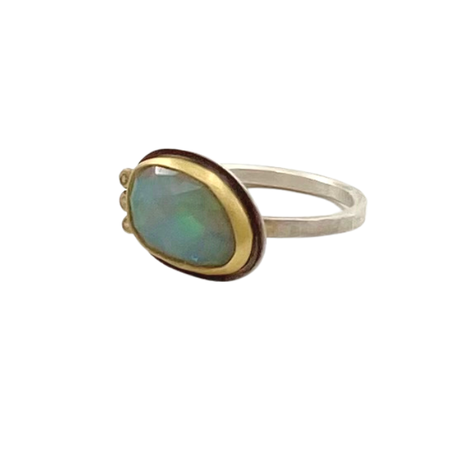 Ananda Khalsa silver ring with opal, gold, and 3 diamonds, angled front view