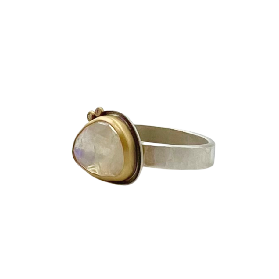 Ananda Khalsa silver ring with moonstone, gold, and diamonds, angled front view
