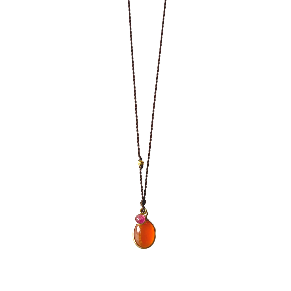 Margaret Solow nylon cord necklace with opal and ruby, front view