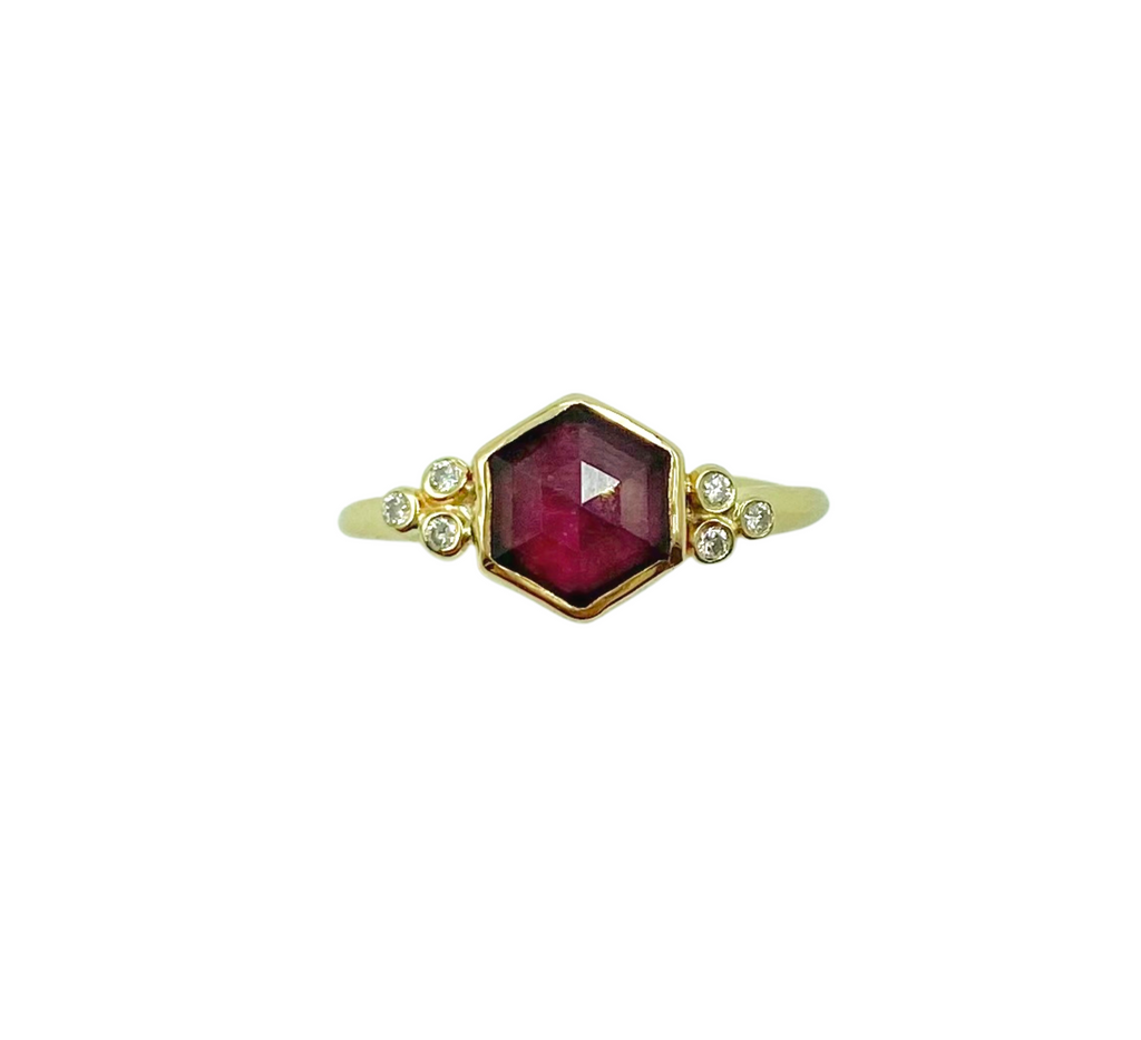 Emily Amey gold ring with garnet and diamonds, front view