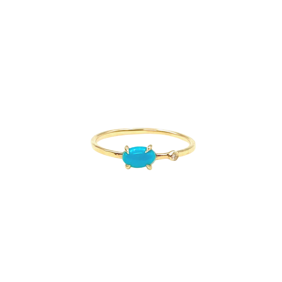 small oval turquoise ring with inset diamond front view
