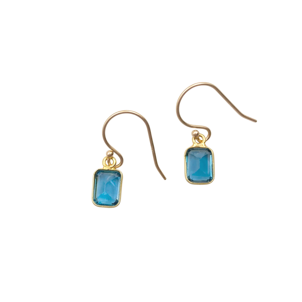 Margaret Solow gold drop earring with blue topaz, front view