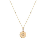 Zoe Chicco gold necklace with heart charm and diamonds, front view