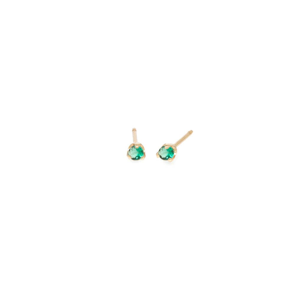 Zoe Chicco gold stud earrings with emerald, angled front view