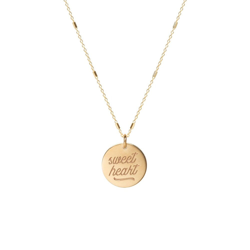 Zoe Chicco gold necklace with sweetheart text pendant, from view