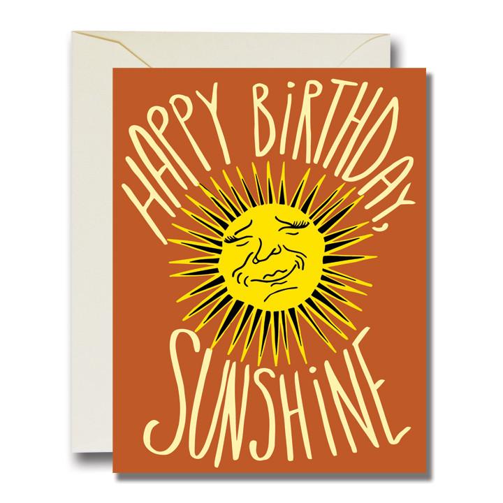 Card with sun illustration text reading "Happy birthday sunshine", front view