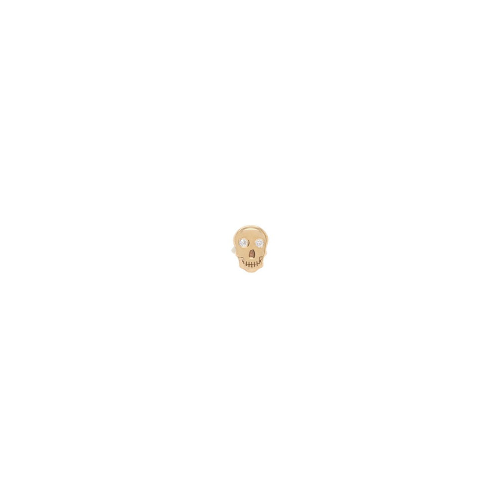 Zoe Chicco gold skull stud earrings with diamond, front view