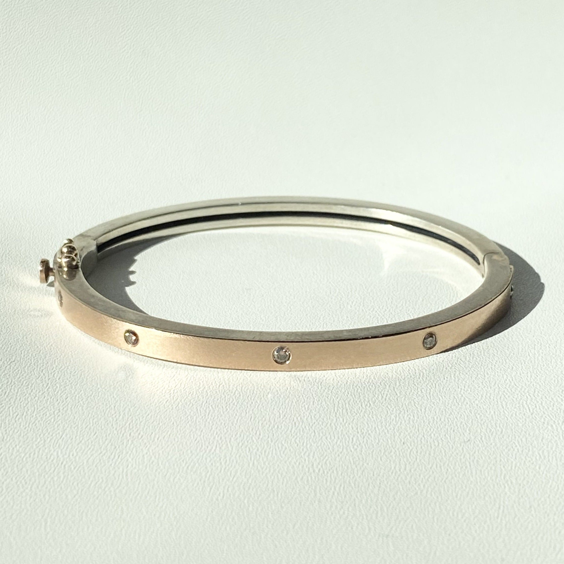 Rene Escobar sterling silver and rose gold bracelet with diamonds, front view