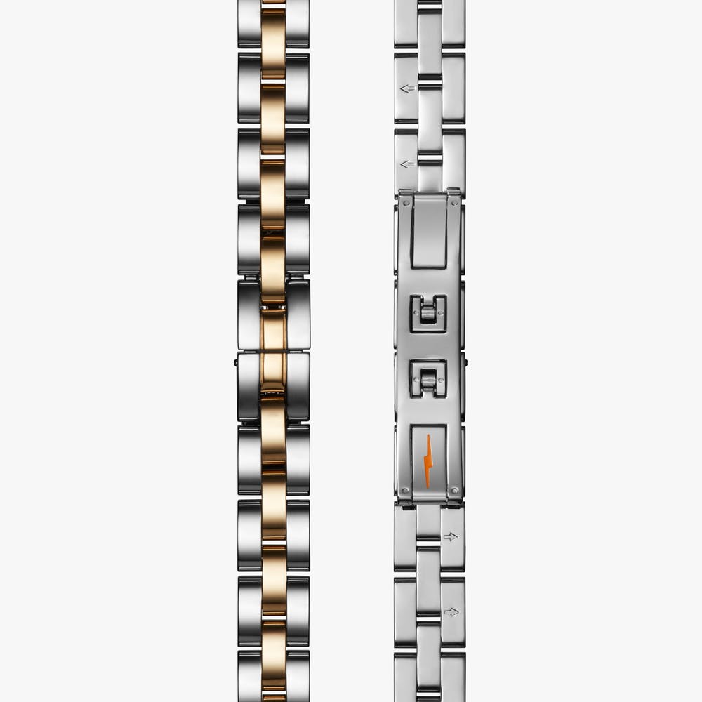 Shinola stainless steel silver and gold watch closure mechanism, front and back view