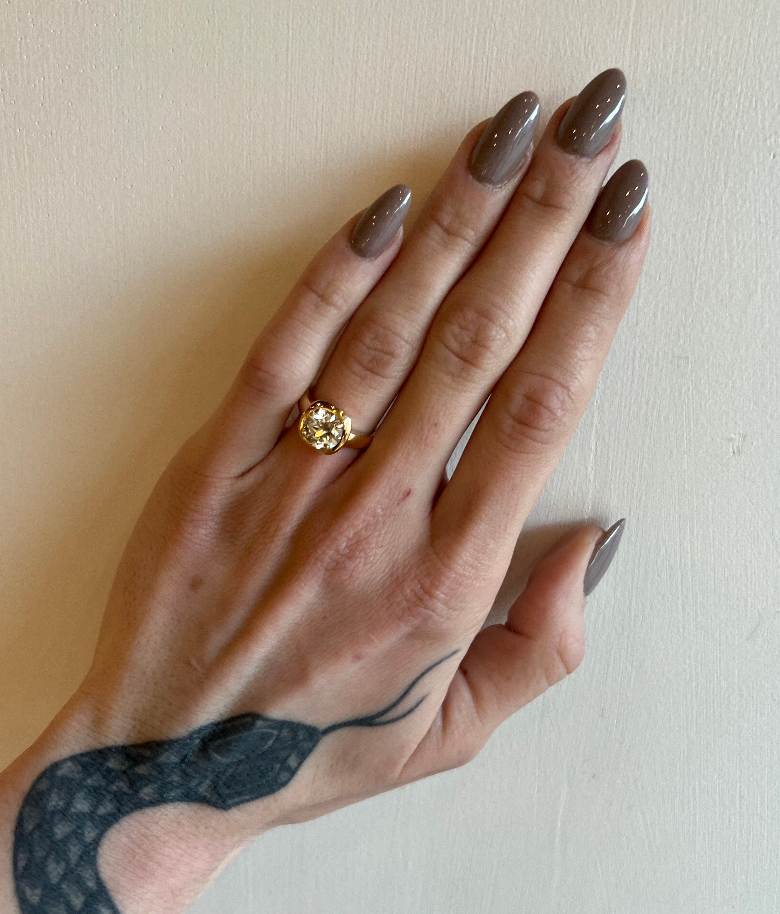 Single Stone gold ring with diamond on model, top view