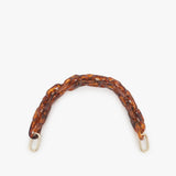 Clare V. brown resin chain purse strap, front view