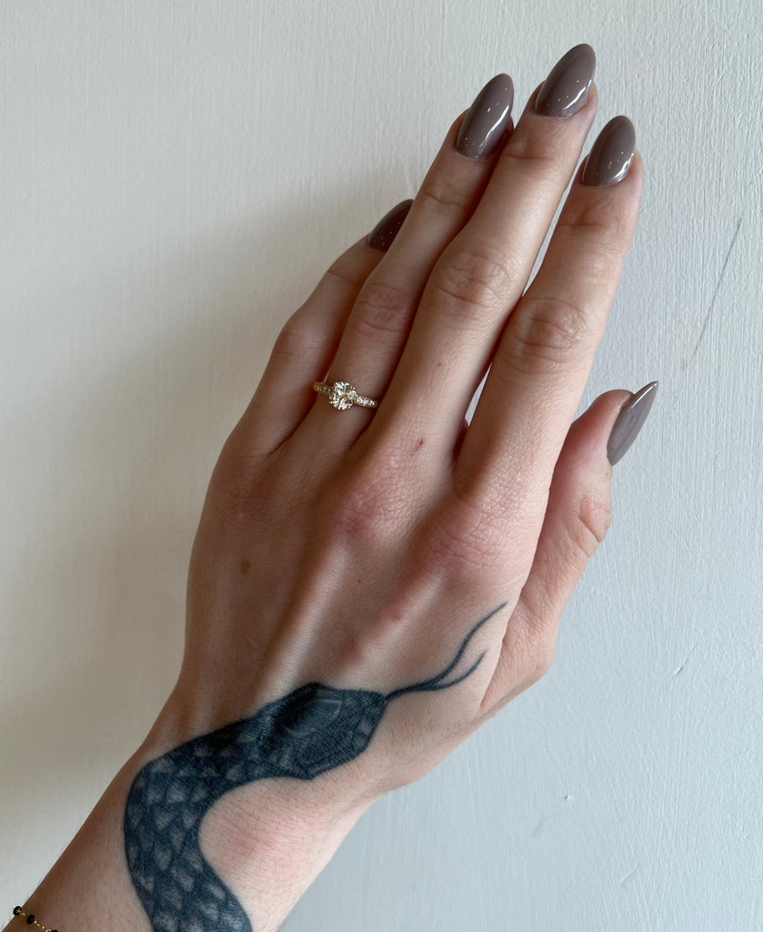 Single Stone gold ring with diamonds on model, top view