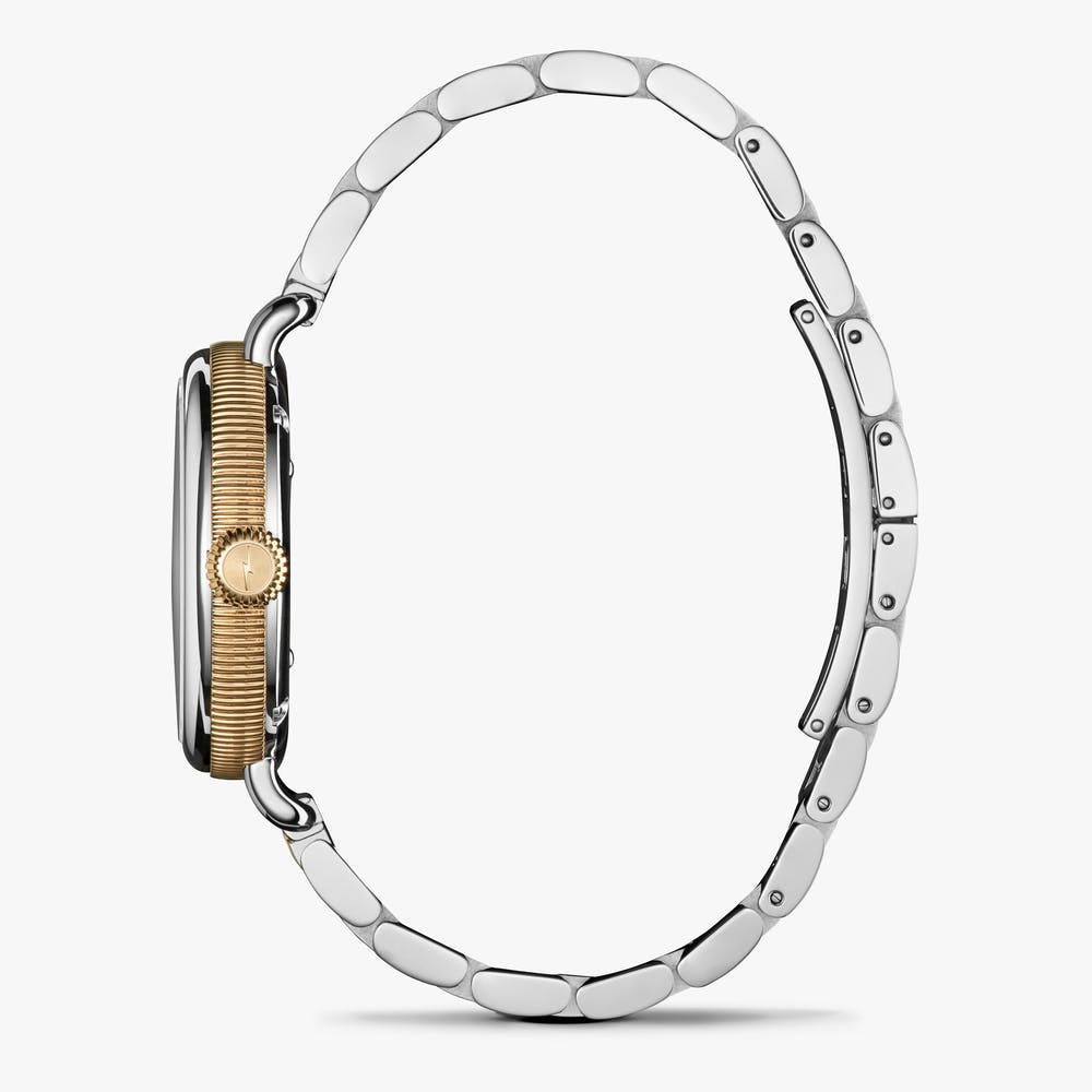 Shinola stainless steel silver and gold watch, side view
