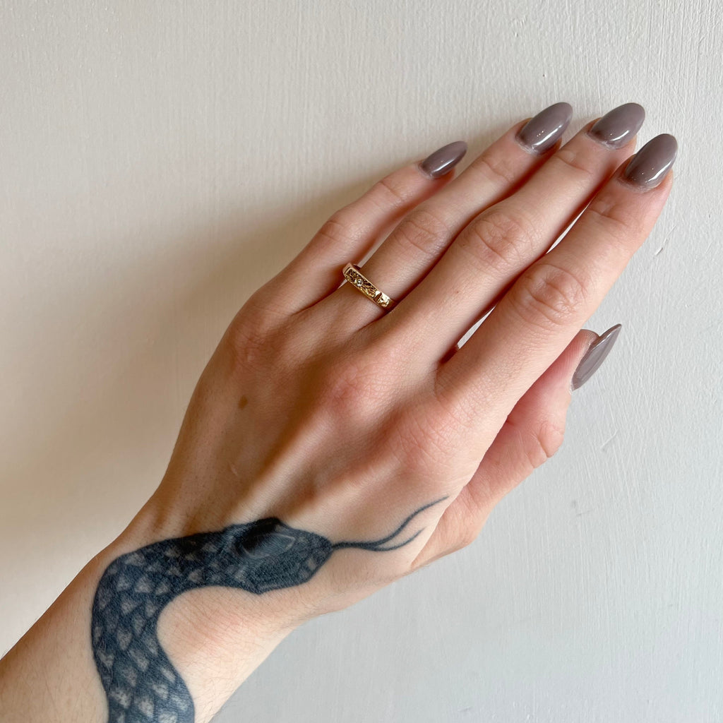 Communion by Joy gold band with diamond on model, front view