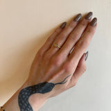 Megan Thorne gold flower ring with diamonds on model, top view