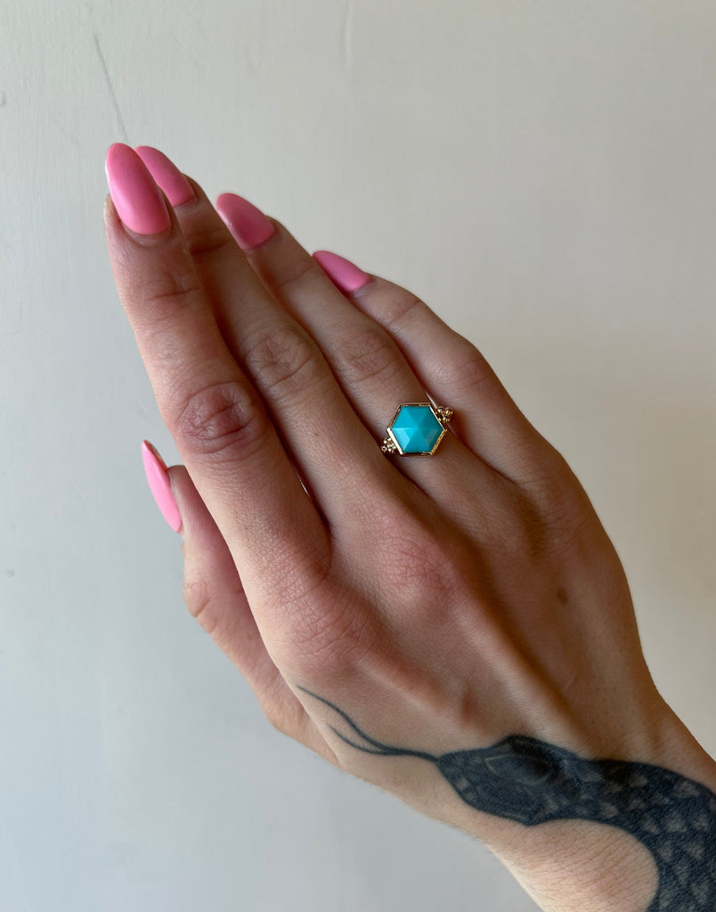Emily Amey gold and silver ring with turquoise on model, front view