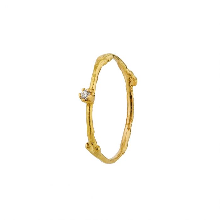 Alex Monroe gold textured band with diamond, angled front view