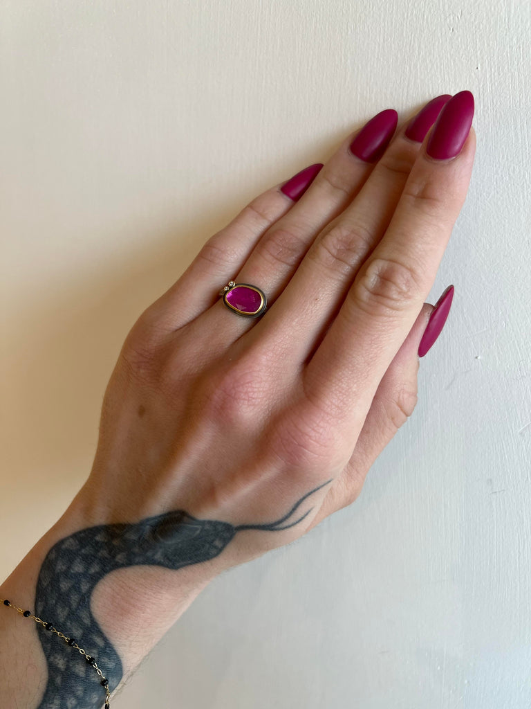 Ananda Khalsa silver ring with ruby, gold, and diamond, on model front view